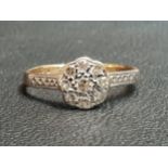 DIAMOND CLUSTER RING in eighteen carat gold and platinum, ring size K