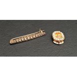 GRADUATED SEED PEARL BAR BROOCH in unmarked gold and with safety clasp, 4cm wide and approximately