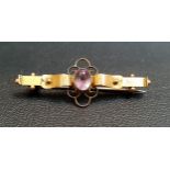 EARLY 20th CENTURY AMETHYST SET BAR BROOCH in nine carat gold, Chester hallmarks for 1910, 4.2cm