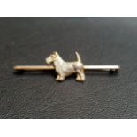 NINE CARAT GOLD TERRIER BROOCH the Fox Terrier set to the centre of the bar, 5.2cm long and