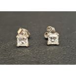 PAIR OF DIAMOND STUD EARRINGS the princess cut diamonds totaling approximately 0.7cts, in nine carat