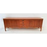 1960s G PLAN MAHOGANY SIDEBOARD with three central panelled drawers with recessed handles, flanked