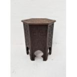 INDIAN HARDWOOD HEXAGONAL OCCASIONAL TABLE with carved decoration overall and a lift up top