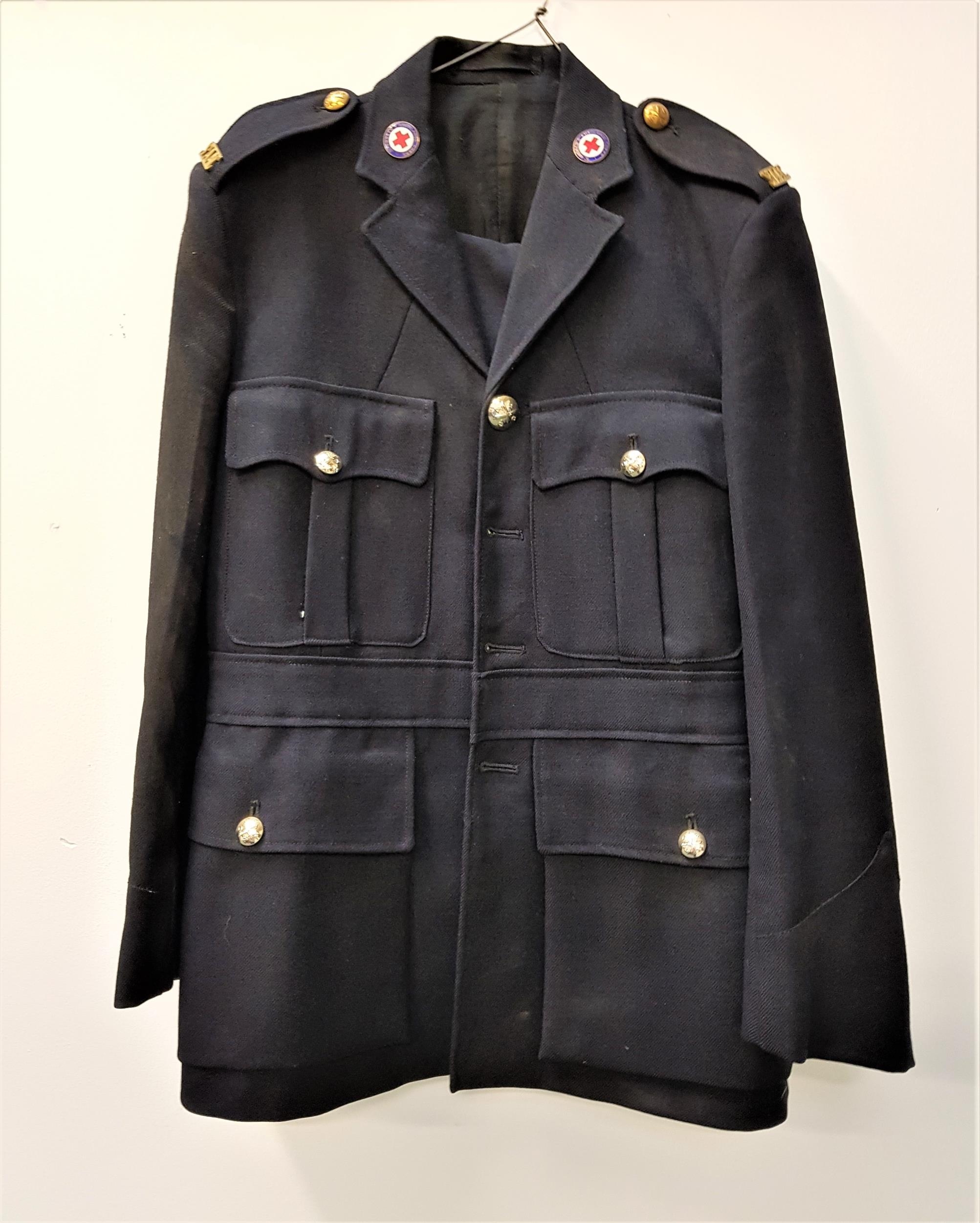 ST. ANDREWS AMBULANCE CORPS UNIFORM comprising a navy blue tunic jacket and trousers, with buttons