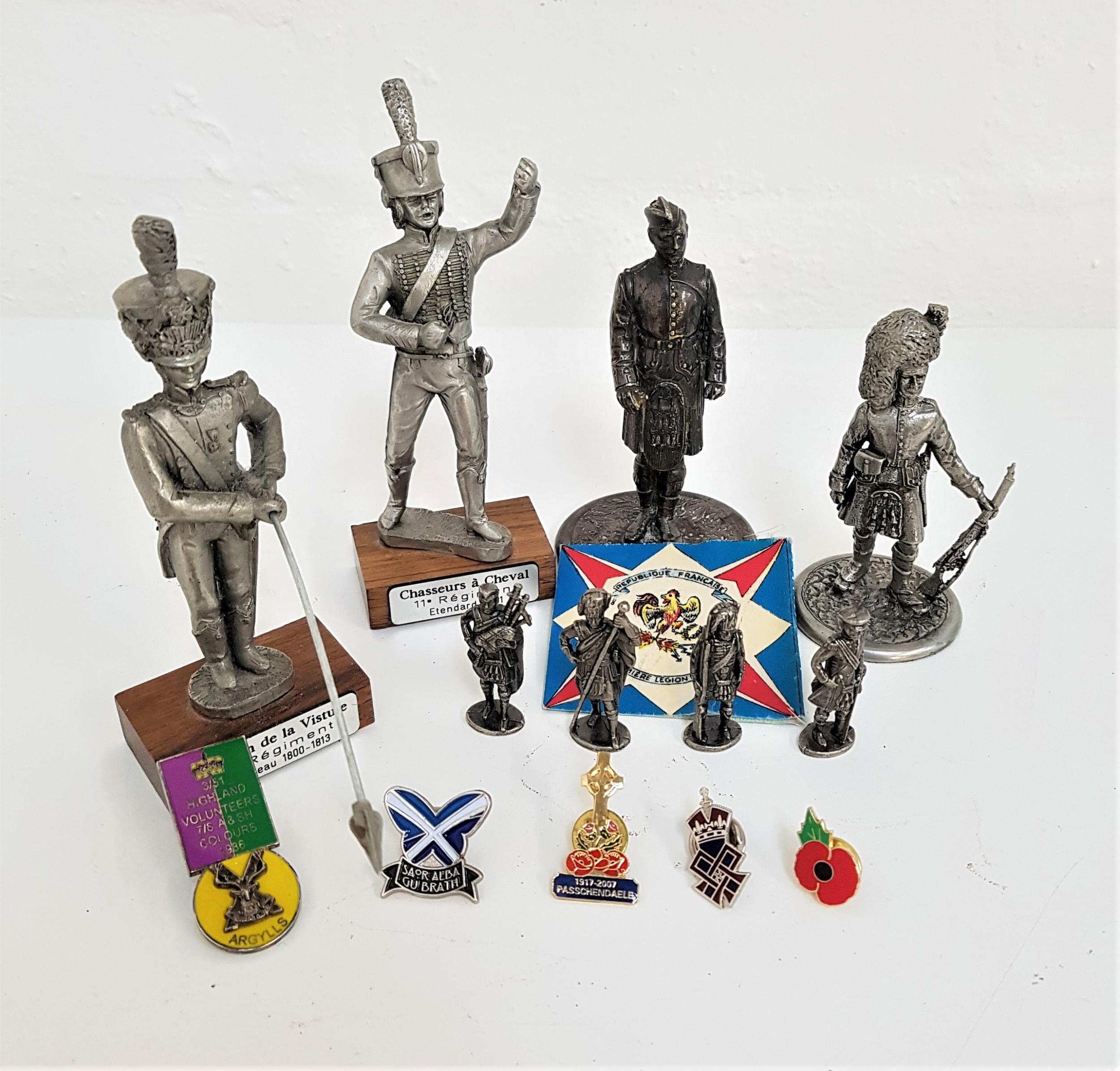 SIX PEWTER SCOTTISH SOLDIERS all in Highland uniform, ranging in height from 4cm to 9.5cm; and two