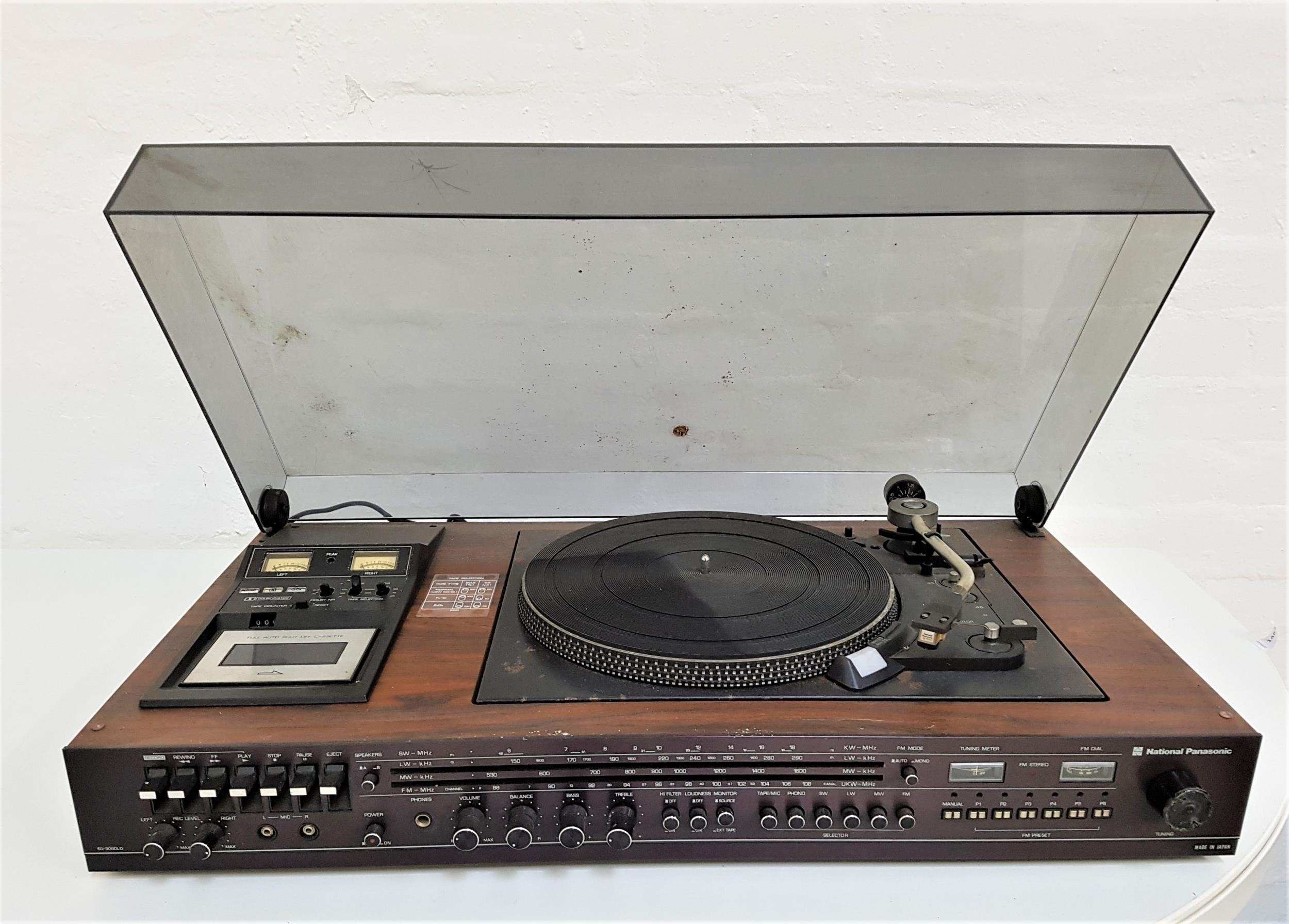 NATIONAL PANASONIC MUSIC CENTRE with a smoked plastic lift up lid revealing a record player,