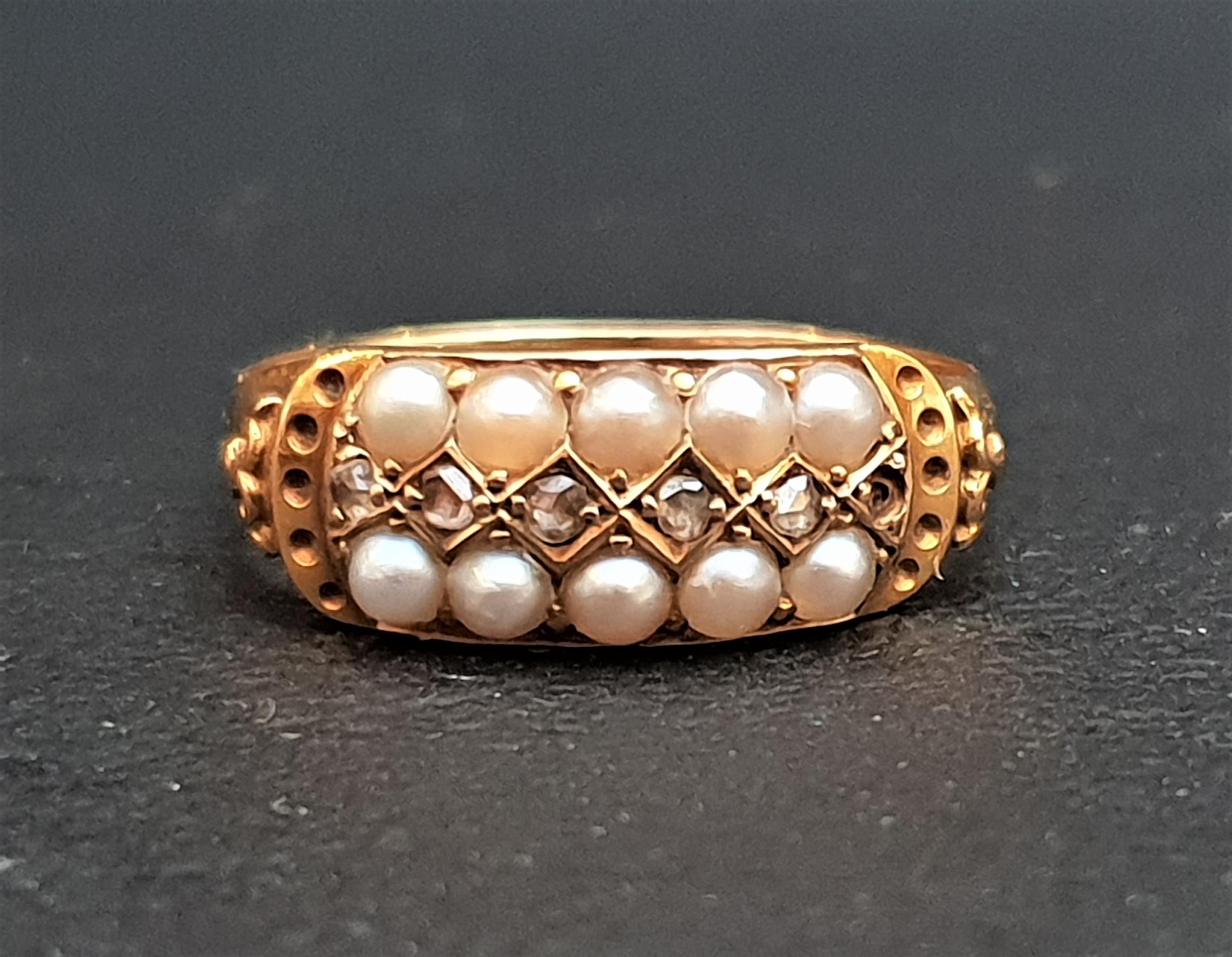 VICTORIAN SEED PEARL AND DIAMOND RING the two rows of pearls separated by small diamonds, in