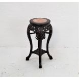 CHINESE HARDWOOD JARDINERE STAND with an inset rose marble top above a carved and pierced frieze,