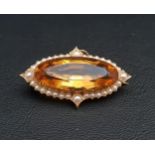 CITRINE AND SEED PEARL CLUSTER BROOCH the large oval cut citrine measuring approximately 30mm x 12mm