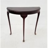 SIMULATED ROSEWOOD SIDE TABLE with a D shaped top, standing on three cabriole supports, 73cm high
