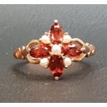 GARNET AND SEED PEARL CLUSTER RING the four oval cut garnets separated by seed pearls, on nine carat