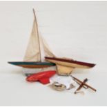 THREE VINTAGE POND YACHTS one with attached mast and sails, 50.5cm long; and two others, 52cm and