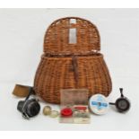 WICKER FISHING CREEL with a canvas shoulder strap, together with two spinning reels and line