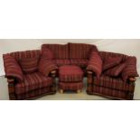 MODERN OAK FOUR PIECE SUITE comprising a two seat sofa, two armchairs and a footstool, all covered