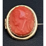 CARVED CORAL CAMEO BROOCH depicting a Classical head in profile, in unmarked gold mount, 2.3cm high