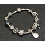 PANDORA MOMENTS SMOOTH SILVER CLASP CHARM BRACELET with a selection of Pandora and other charms,