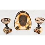 ART DECO CLOCK GARNITURE the arched orange marble clock with a circular hammered brass dial with