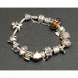 PANDORA MOMENTS SILVER CHARM BRACELET with a selection of twelve charms, one clip and a safety