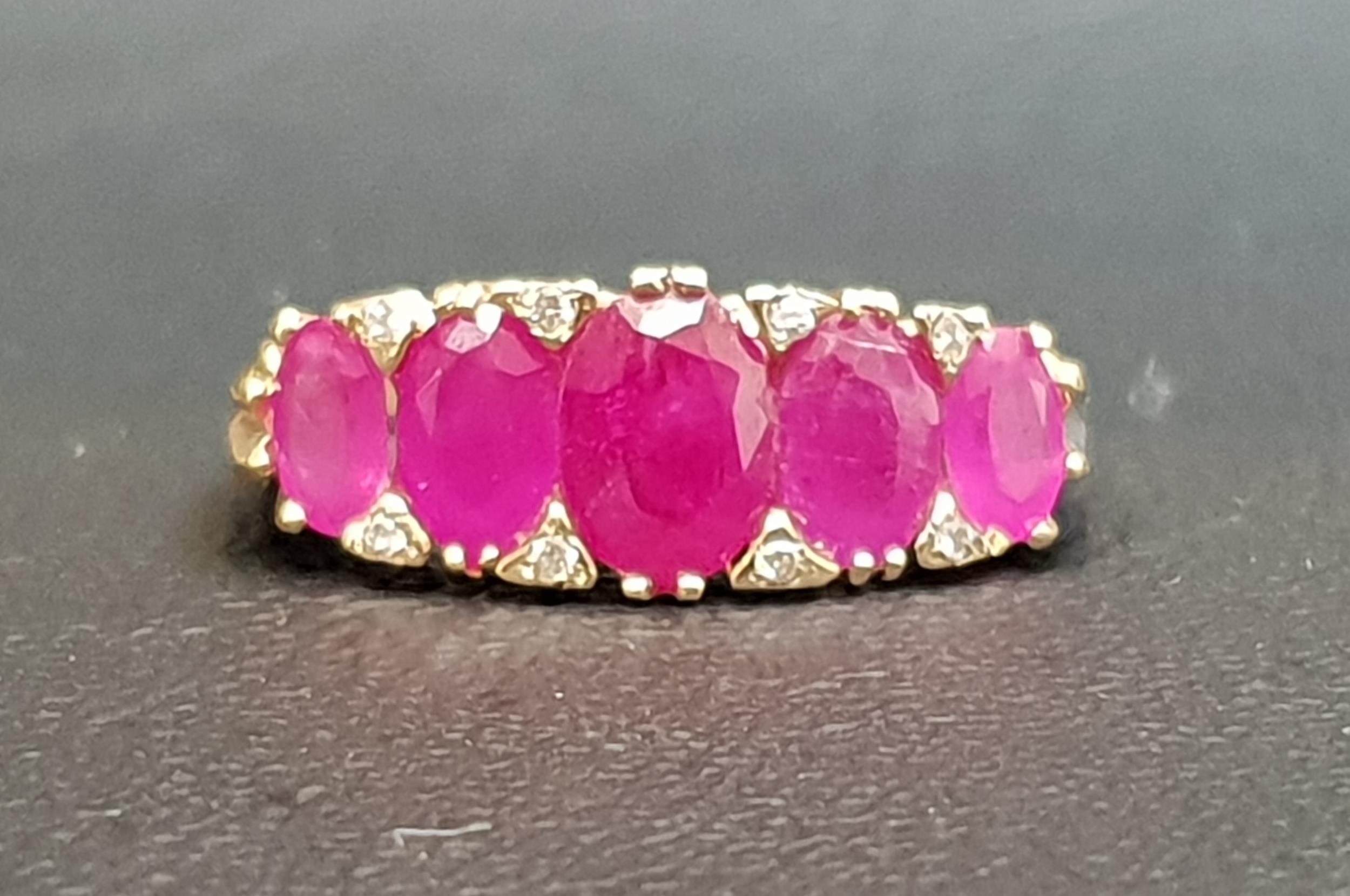 GRADUATED RUBY FIVE STONE RING the five oval cut rubies ranging from 0.75cts in the centre and 0.