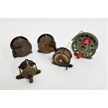 FOUR VINTAGE BRASS FISHING REELS unnamed, 5.7", 5.7", 5" and 4" diameters, together with a green