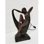 ART DECO STYLE FIGURAL LAMP the seated nude bronzed plaster figure with draping fabric, raised on