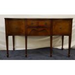 MAHOGANY AND CROSSBANDED BOW FRONT SIDEBOARD with two central drawers flanked by a pair of