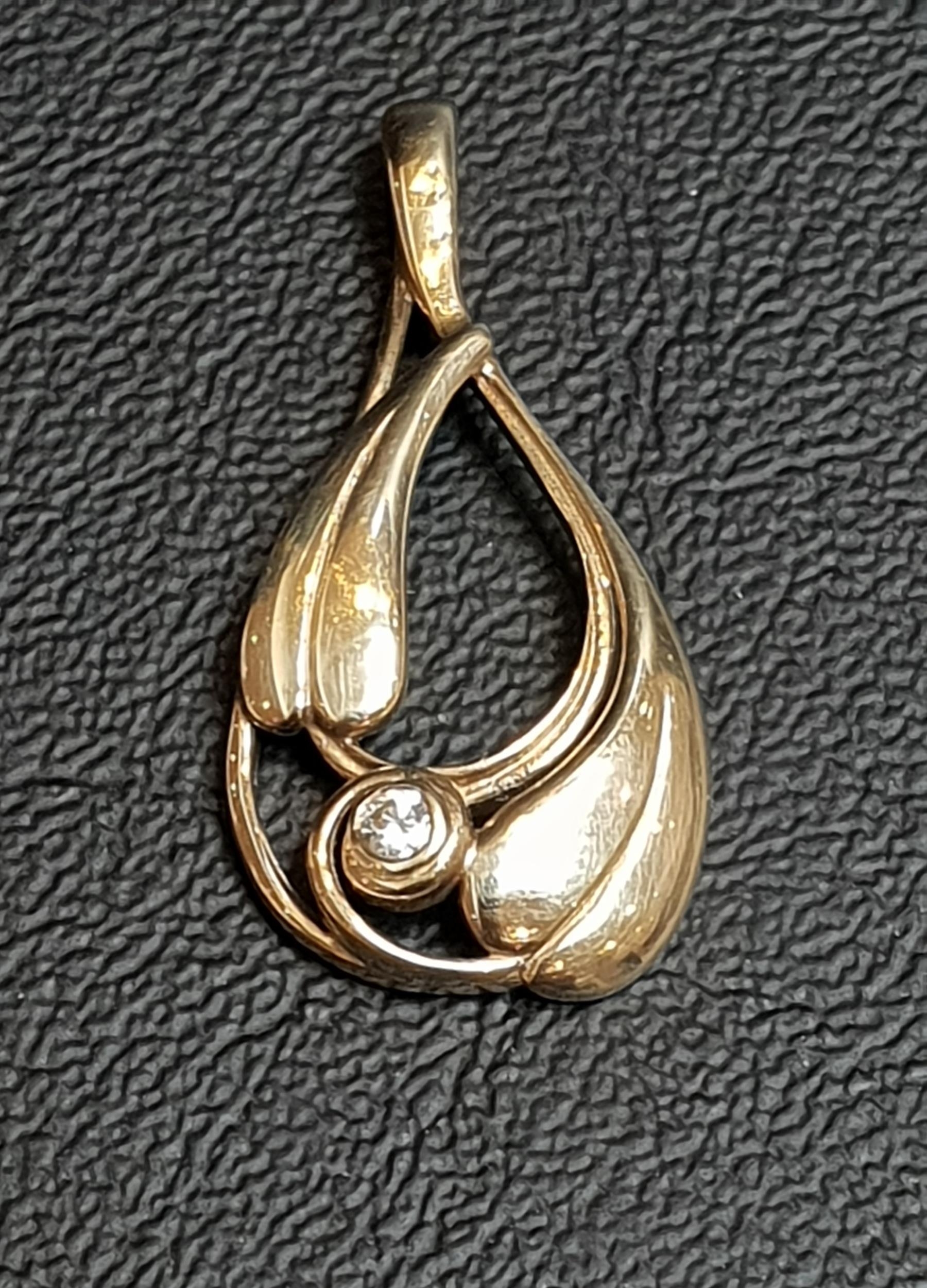 OLA GORIE DIAMOND SET NINE CARAT GOLD PENDANT the entwined and leaf motif decorated pendant with