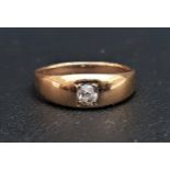 DIAMOND SINGLE STONE RING the flush set diamond approximately 0.2cts, on gold shank with