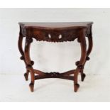 INDONESIAN TEAK SIDE TABLE with a shaped top above a carved frieze, standing on carved and shaped