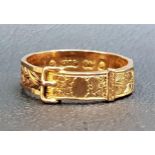 VICTORIAN NINE CARAT GOLD MOURNING RING of buckle design with entwined hair around the shank,