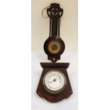 ART DECO ANEROID BAROMETER in a stepped shaped oak frame centred with a silvered dial, 24cm high,