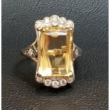 CITRINE AND DIAMOND CLUSTER DRESS RING the central citrine measuring approximately 13.8mm x 10mm x