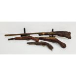 DECORATIVE REPRODUCTION FLINTLOCH GUN with a teak carved stock, 105cm long, together with three
