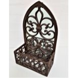 DECORATIVE IRON FRAME WALL MIRROR of arch design with a fleur de lis pattern and decorative front
