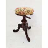 VICTORIAN ROSEWOOD PIANO STOOL with a circular adjustable seat on a turned tapering column with