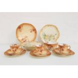 LIMOGES PART TEA SERVICE decorated in peach and gilt with sprays of flowers, comprising cups and