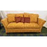 LARGE TWO SEAT SOFA with a shaped back and scroll arms, with loose back and seat cushions covered in