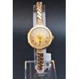 LADIES VINTAGE NINE CARAT GOLD CASED WRISTWATCH the dial with Roman numerals, on expanding