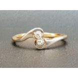 PRETTY DIAMOND TWO STONE RING on eighteen carat gold shank with twist setting, on eighteen carat