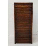 OAK TAMBOUR FRONT CABINET believed to contain drawers (currently locked without key)