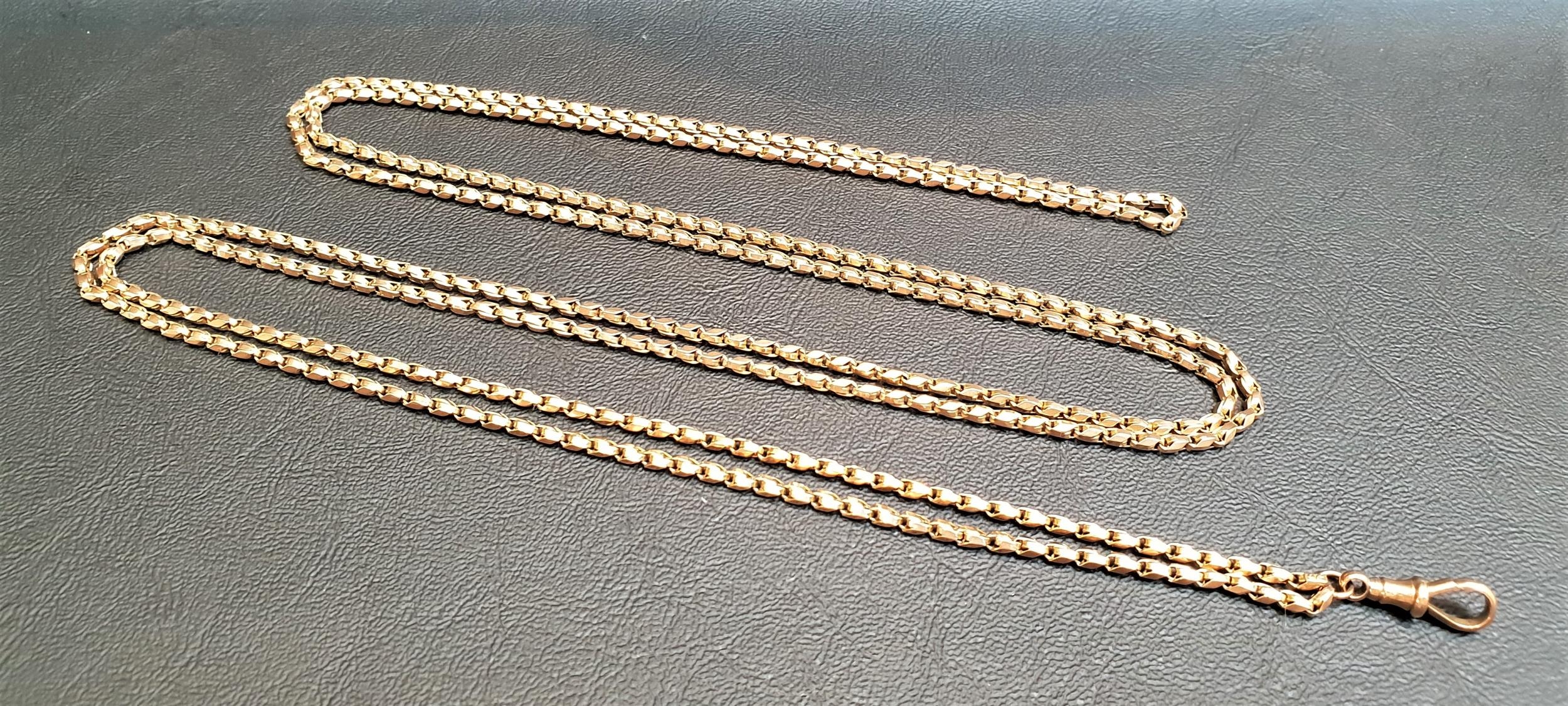 LONG NINE CARAT GOLD GUARD CHAIN approximately 150cm long, with nine carat gold clip, total weight