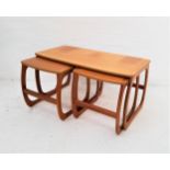 NATHAN TEAK NEST OF TABLES standing on shaped supports, 51cm high