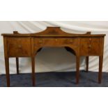 MAHOGANY AND INLAID SERPENTINE SIDEBOARD with a shaped and raised back above a central drawer