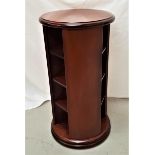 MODERN MAHOGANY CIRCULAR REVOLVING CABINET with twelve open shelves, 68.5cm high