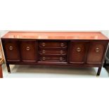 G PLAN MAHOGANY SIDEBOARD with three central drawers flanked by two pairs of panelled cupboard