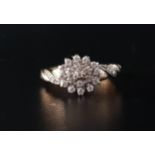 DIAMOND CLUSTER RING the multi diamonds totaling approximately 0.25cts, on nine carat gold shank,