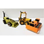 THREE VINTAGE TONKA TOYS comprising an orange bulldozer, yellow articulated fork lift and a green