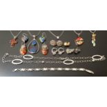 SELECTION OF SILVER AND SILVER MOUNTED JEWELLERY comprising seven pendants of various designs on