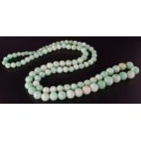 GRADUATED JADE BEAD NECKLACE approximately 70cm long and 60 grams, the box marked 'Cecil Arts.