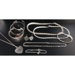 SELECTION OF SILVER JEWELLERY including three bangles, two matching plaited necklaces and a